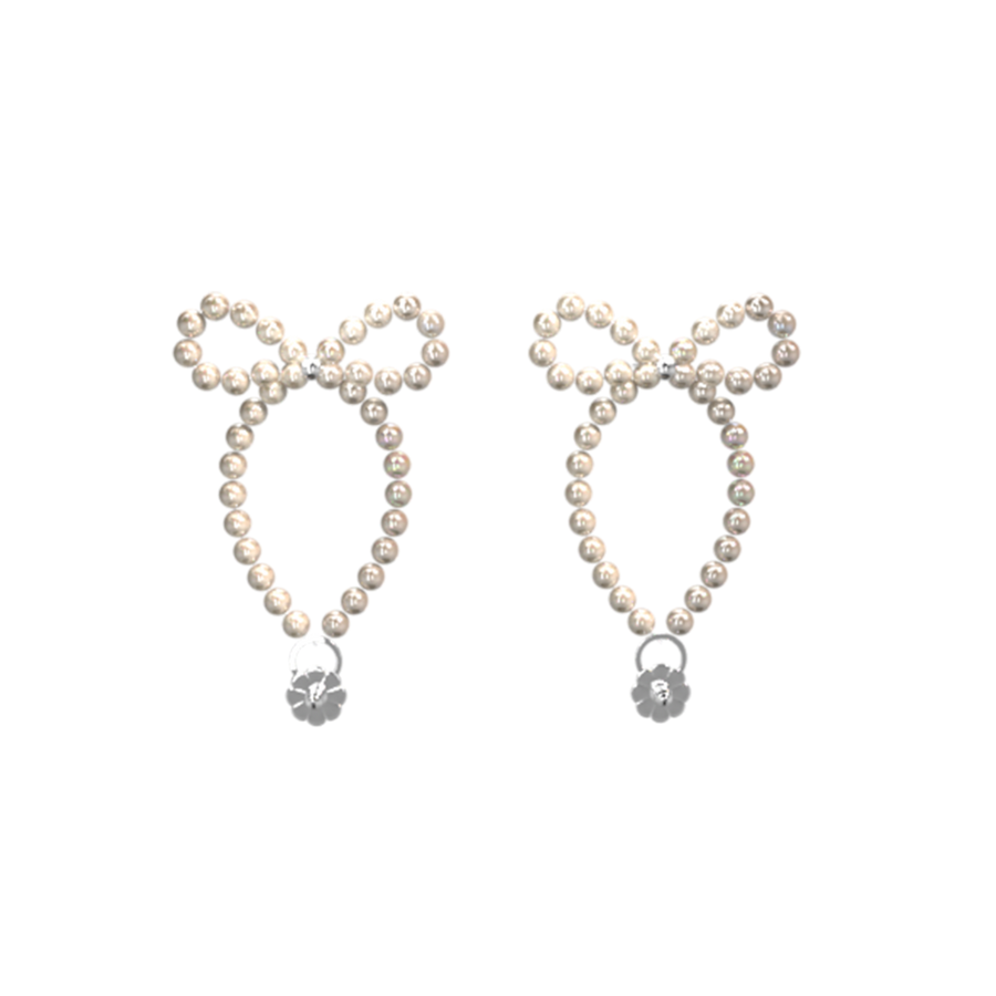 White pearl-beaded Fullice Bow Shell earrings on a black background