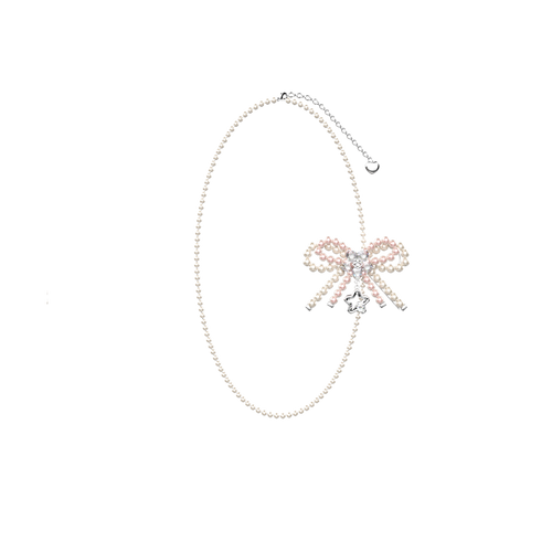 Petalia pale pink beaded bow necklace on a black background
